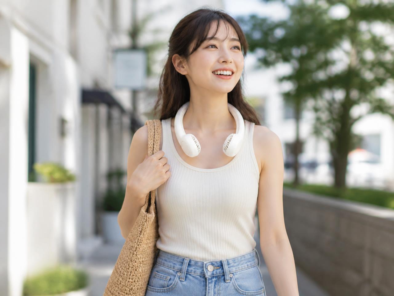 Woman wearing the BreezeLoop neck fan outdoors